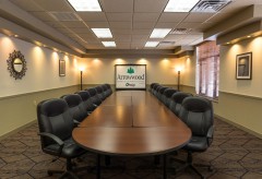Sandhill Large boardroom with a large table and chairs surrounding it 