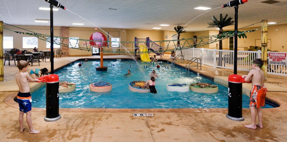 Waterpark Area with climbing area, water guns, and slide