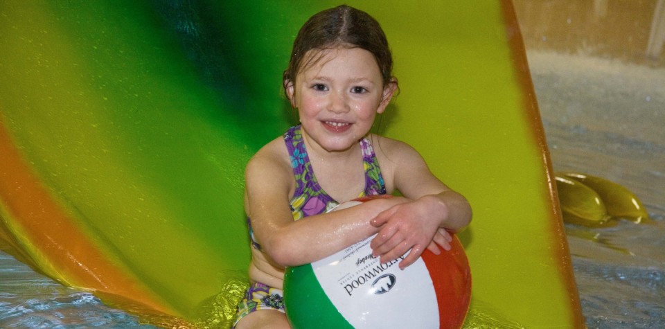 Girl with a Beach Ball playing in the water